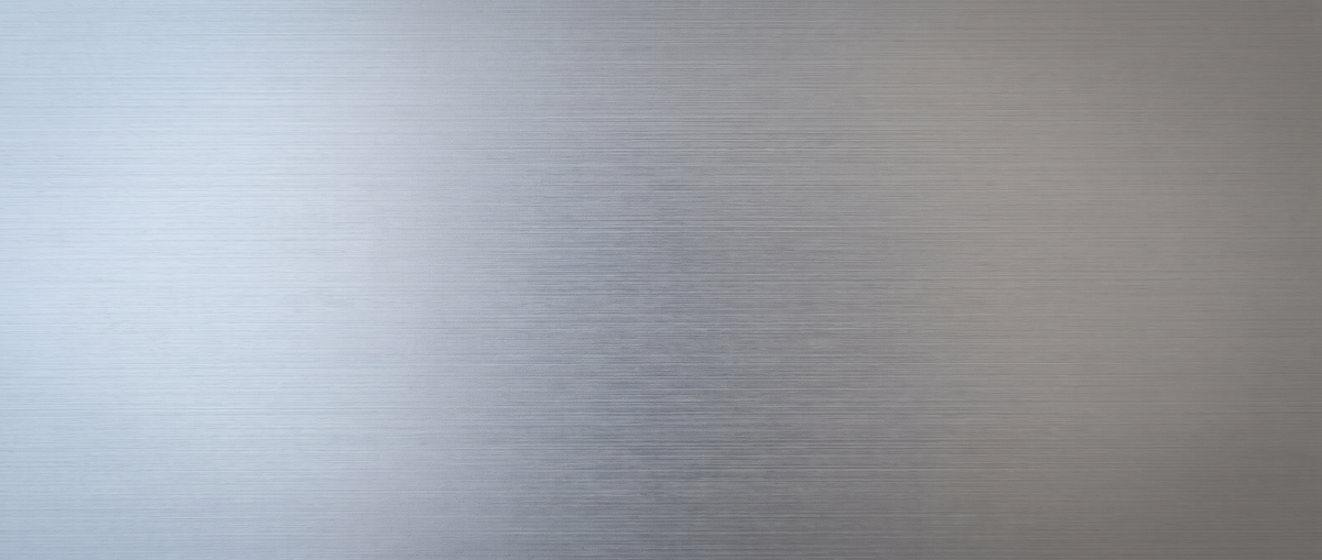 A wide band of brushed metal, fine directional grain running across the frame.