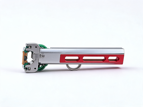 VANTA V10 side profile: full length of the brushed silver aluminium body, red slotted magazine channel, stainless thumb loop and folding roller fork with green flat bands