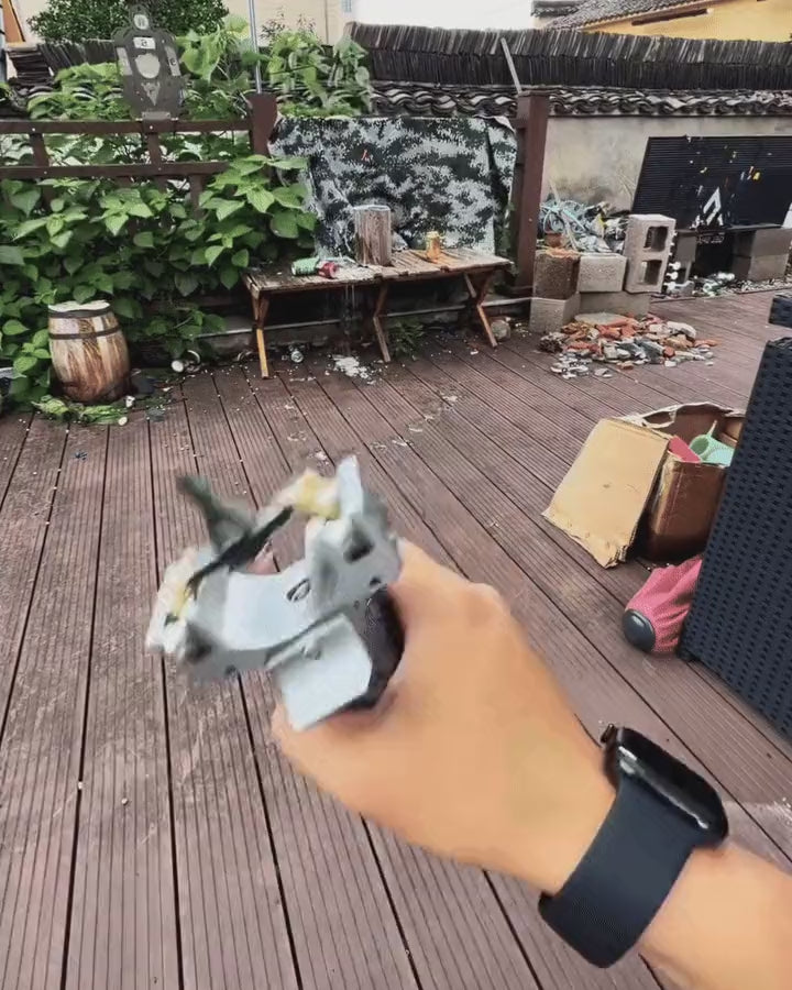 The V11 drawn and released outdoors, seen from behind the hand