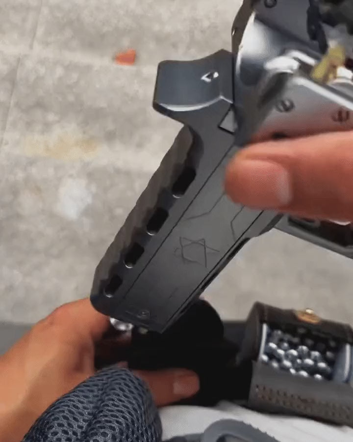 The VANTA V11 turned over in the hands, showing the metal body from every side